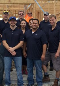 Argo employees building a house for Habitat for Humanity